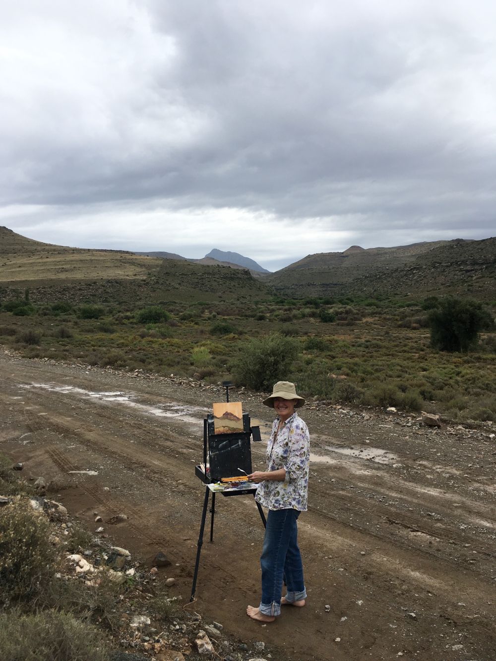 Tracy painting in Nieu-Bethesda, Great Karoo Tracy painting barefoot just outside Nieu Bethesda in the Karoo